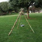 Adjustable stainless steel campfire tripod board for outdoor cooking